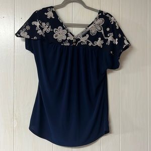 PerSeption Concept navy blue blouse with white flower decal